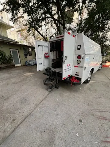 Magnet Plumbing service vehicle on-site for Grease Trap Cleaning in Edgewater